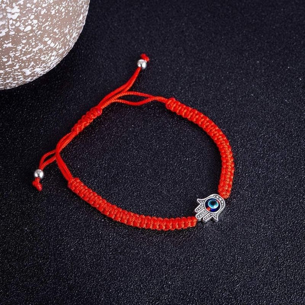 Pulsera de hilo rojo con mano de Hamsa: protección contra el mal de ojo